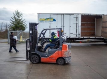 Forklift driving through.