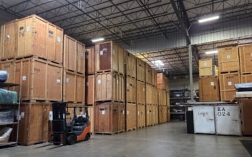 Interior of a storage warehouse with wooden storage vaults stacked to the ceiling